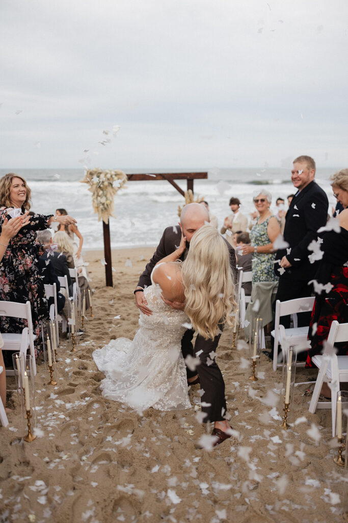 newlyweds kissing after their ceremony