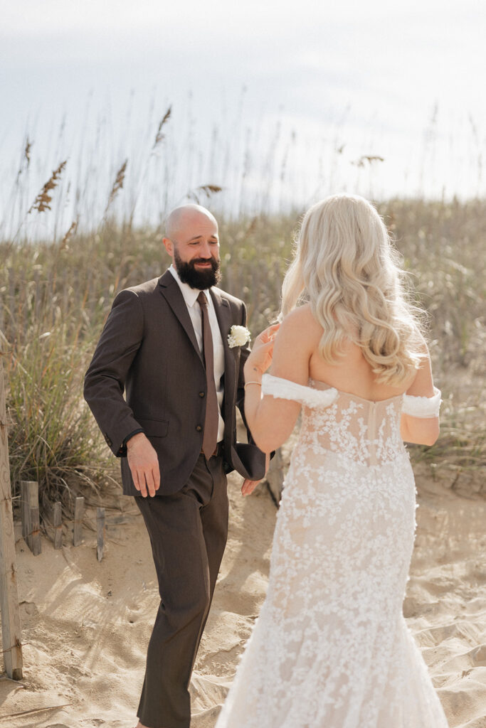 groom emotional seeing the bride in her wedding dress
