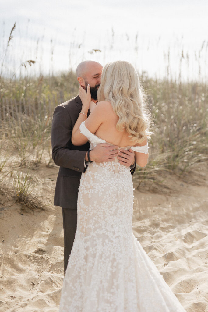 bride and groom kissing at their first look