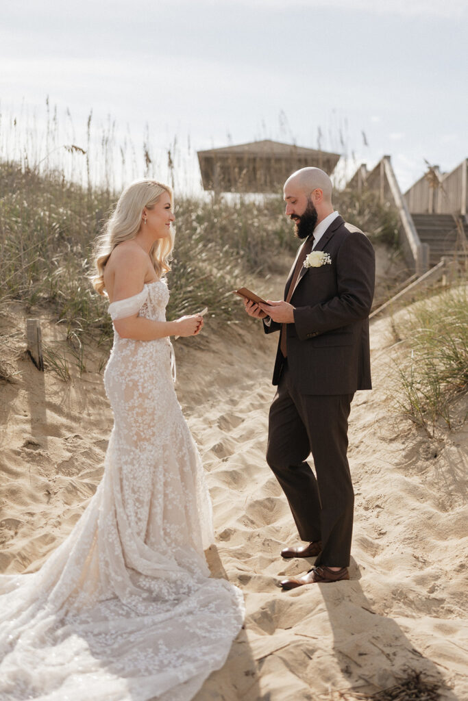 bride and groom reading their private vows