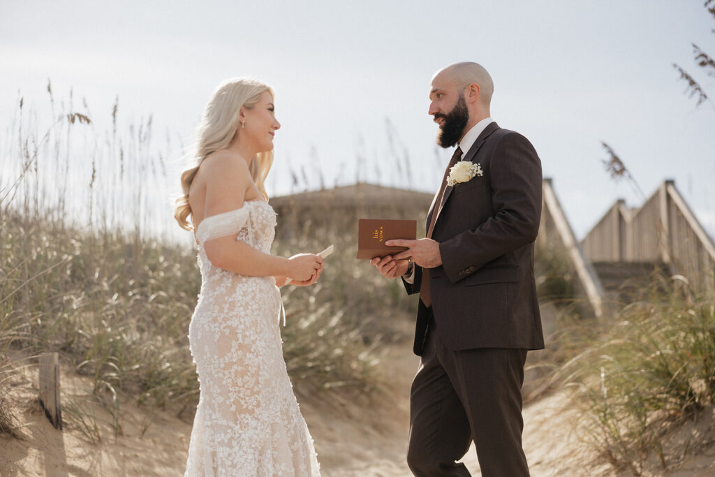 bride and groom emotional while reading their vows
