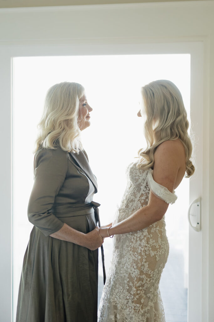 cute picture of the bride and her mom looking at each other