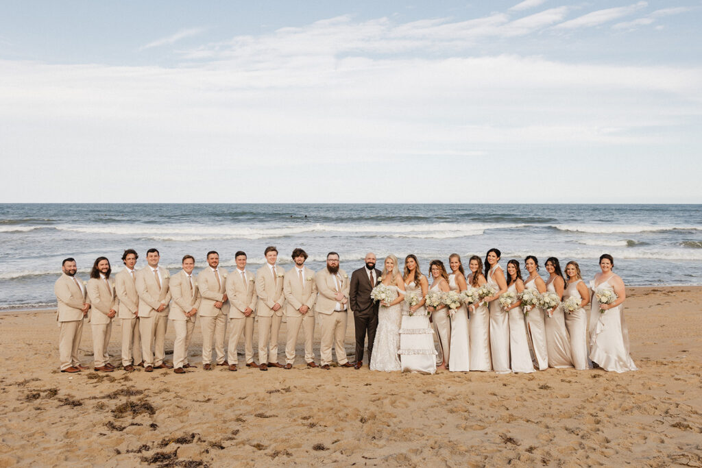 portrait of the bride and groom with their wedding party