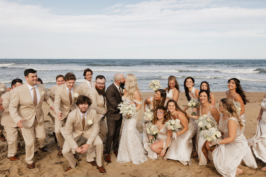 playful picture of the bride and groom with their friends