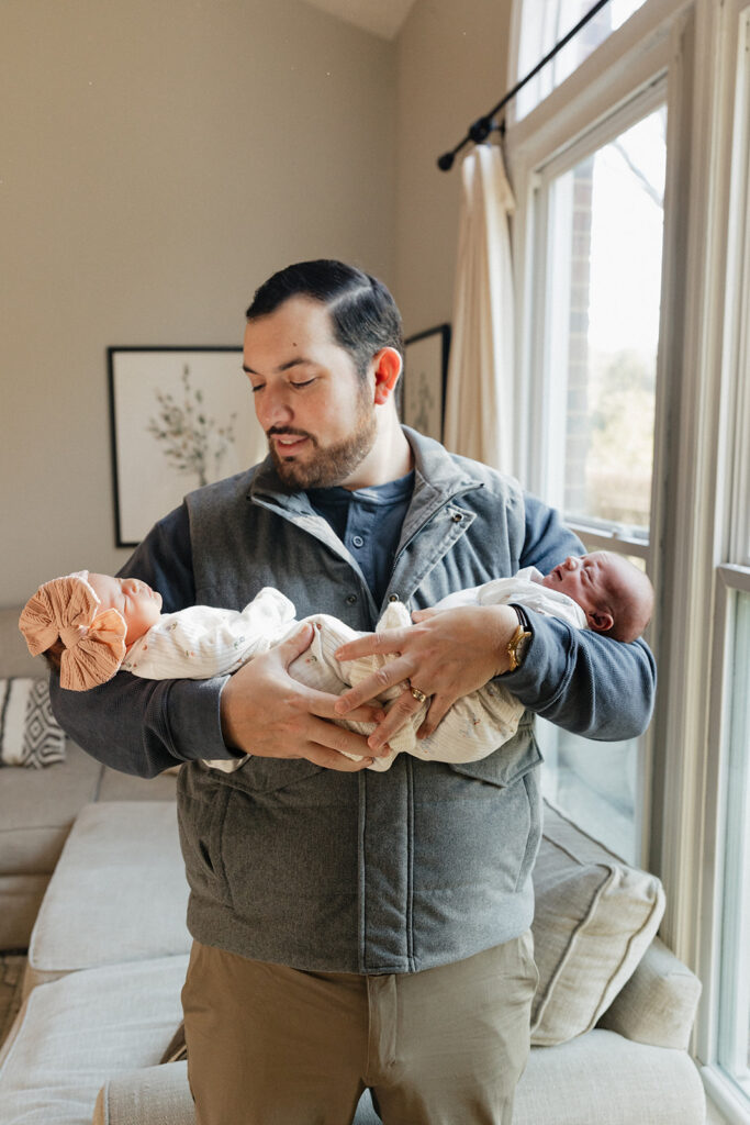 dad holding his twins during their session