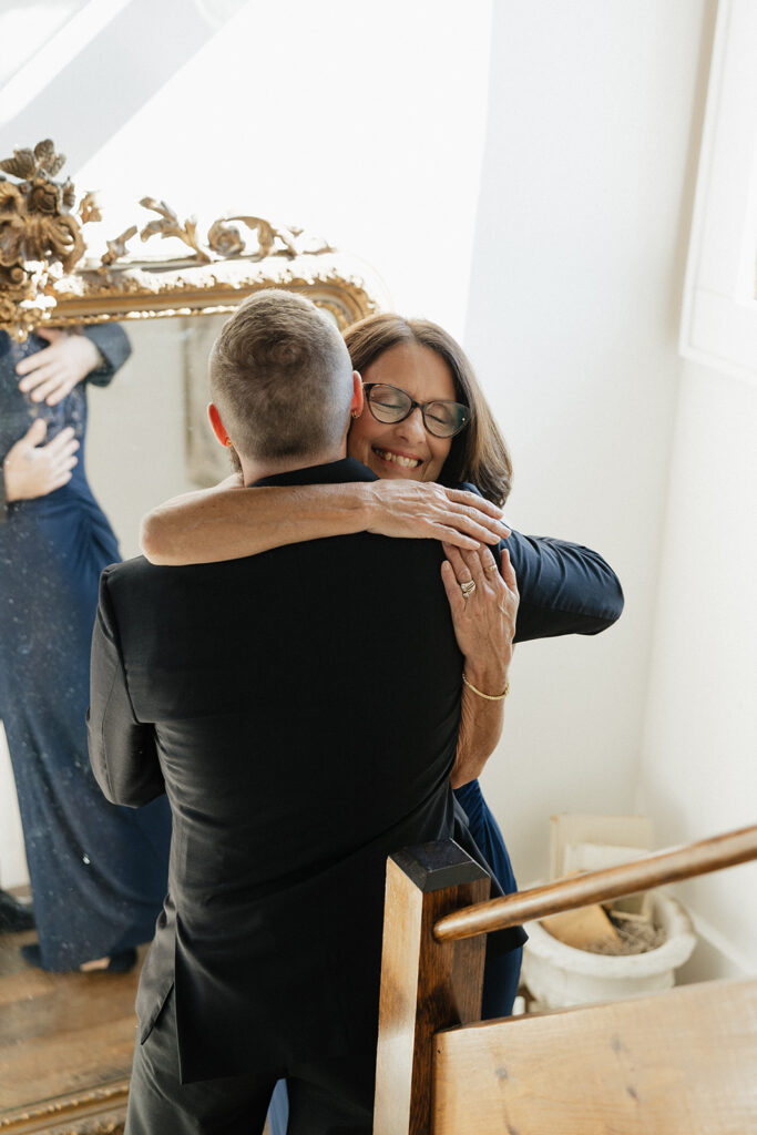 groom and his mother hugging