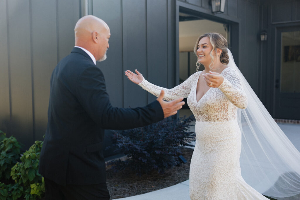 bride and her dad hugging after their first look