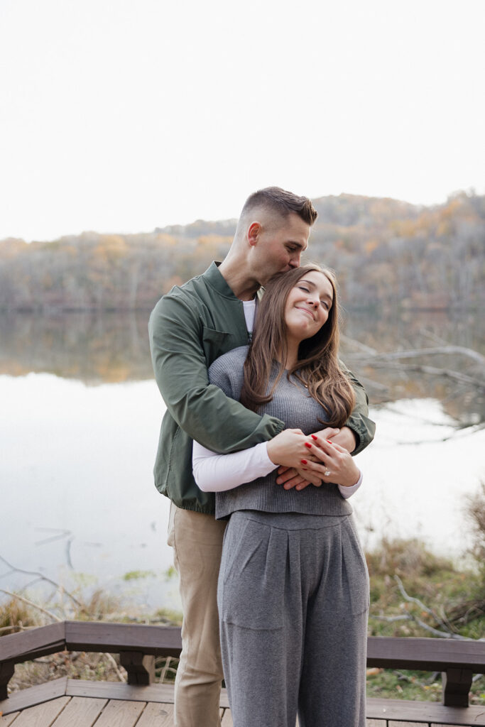 fiance kissing his fiance on the head