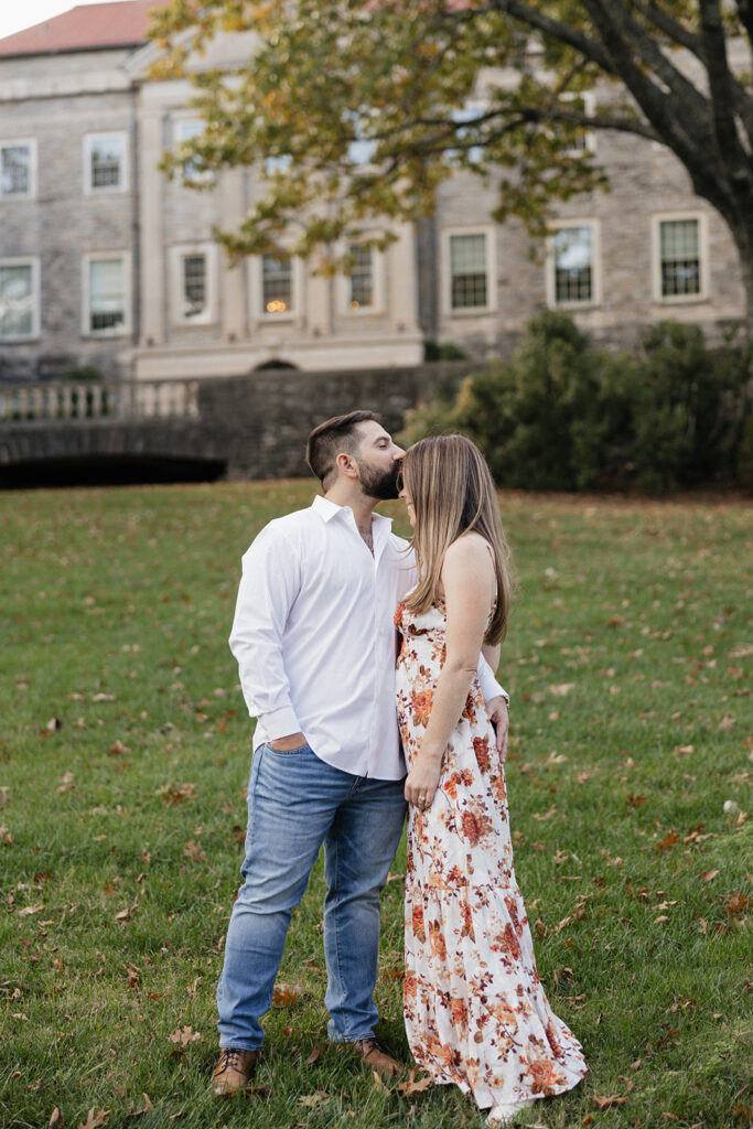 fiance kissing his fiance on the forehead