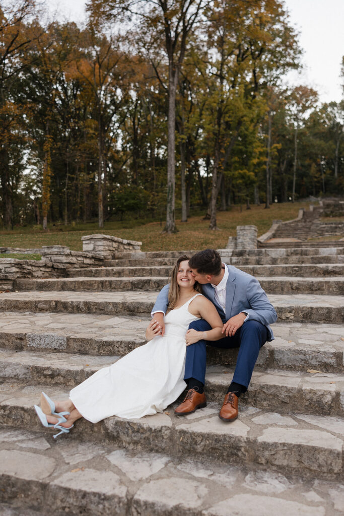 fiance kissing his fiance on the cheek
