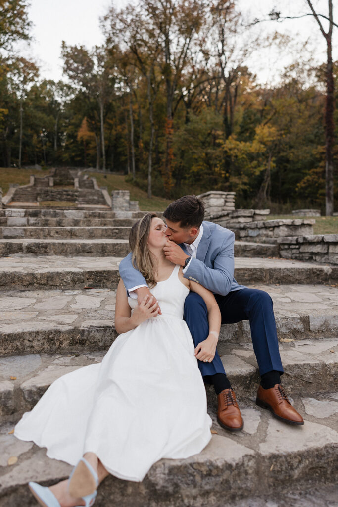 newly engaged couple kissing during their engagement photoshoot