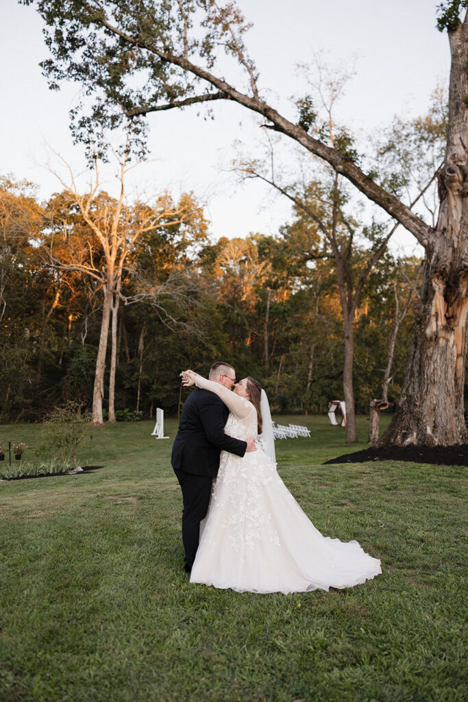 cute picture of the bride and groom kissing during their bridal portraits