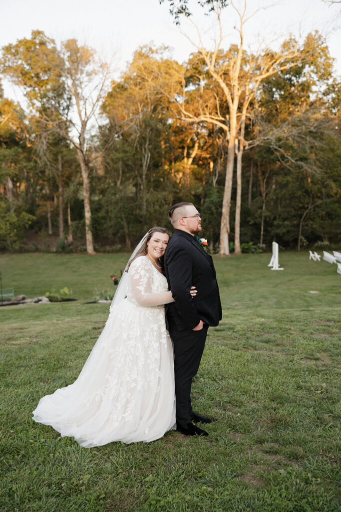 cute picture of the bride hugging the groom