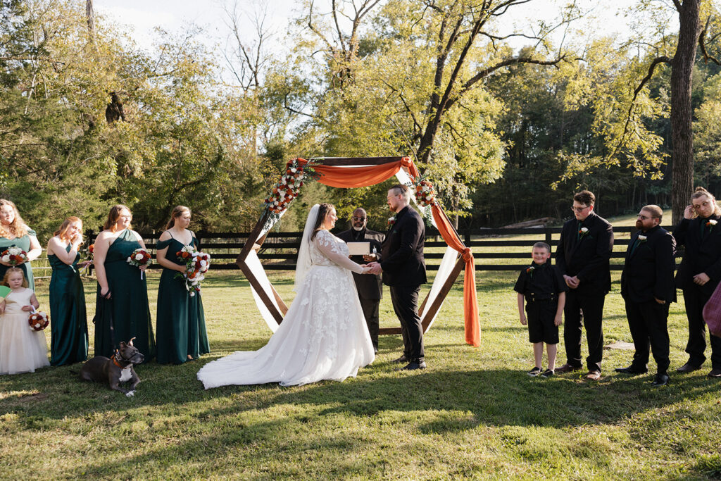 bride and groom holding hands at their ceremony