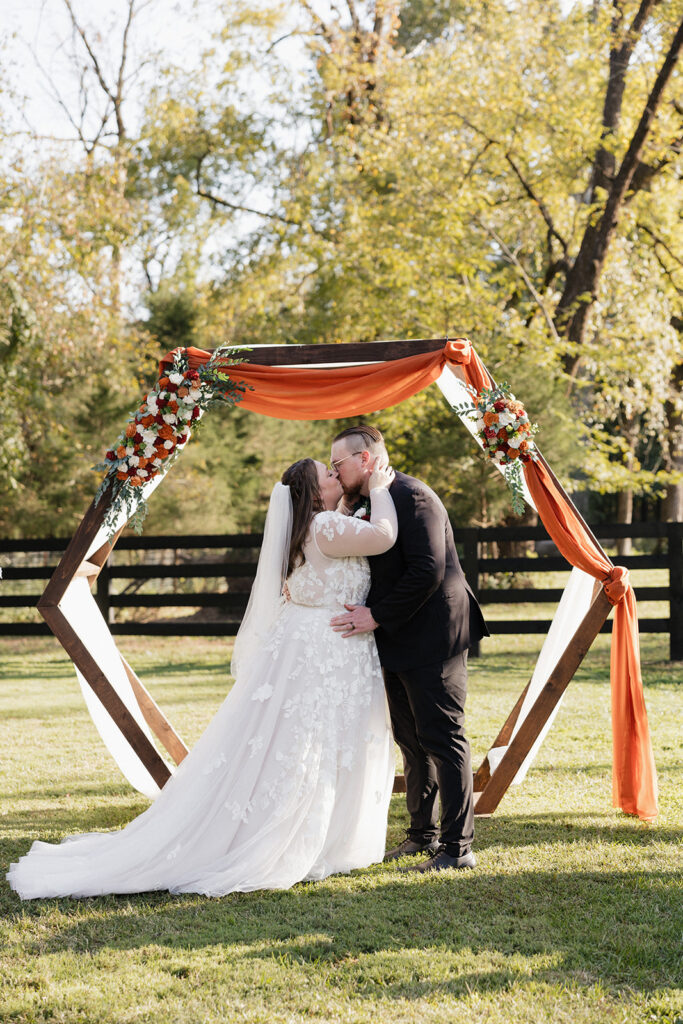 cute picture of the newlyweds kissing after their ceremony