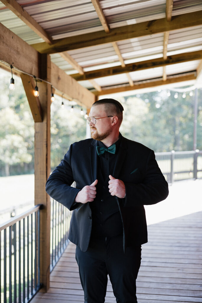 groom getting dressed for his ceremony