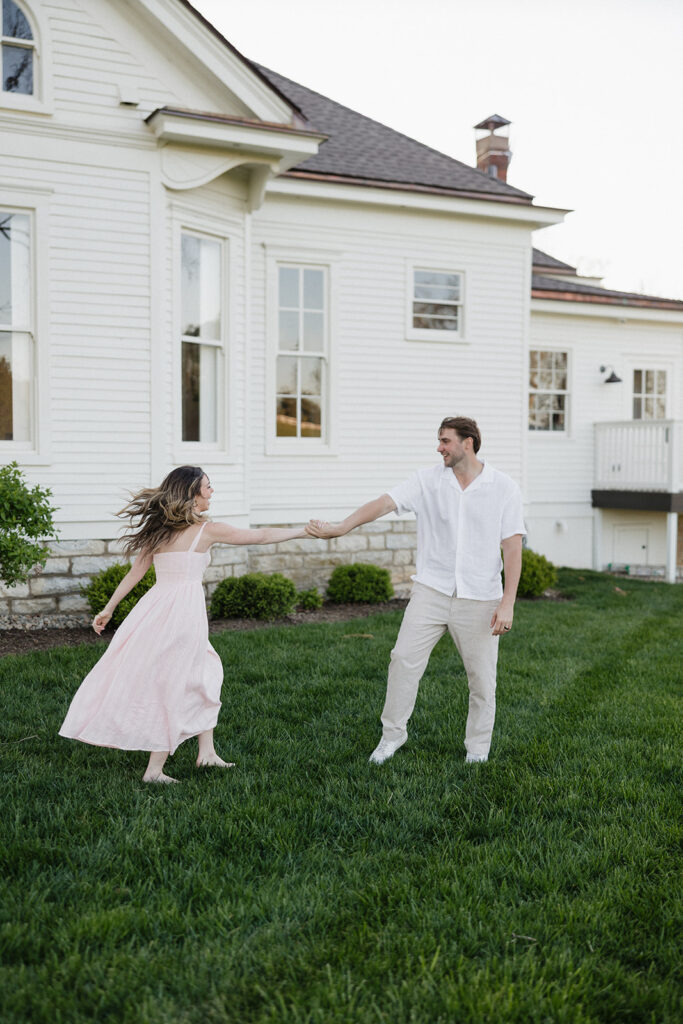 newly engaged couple dancing during their photos session