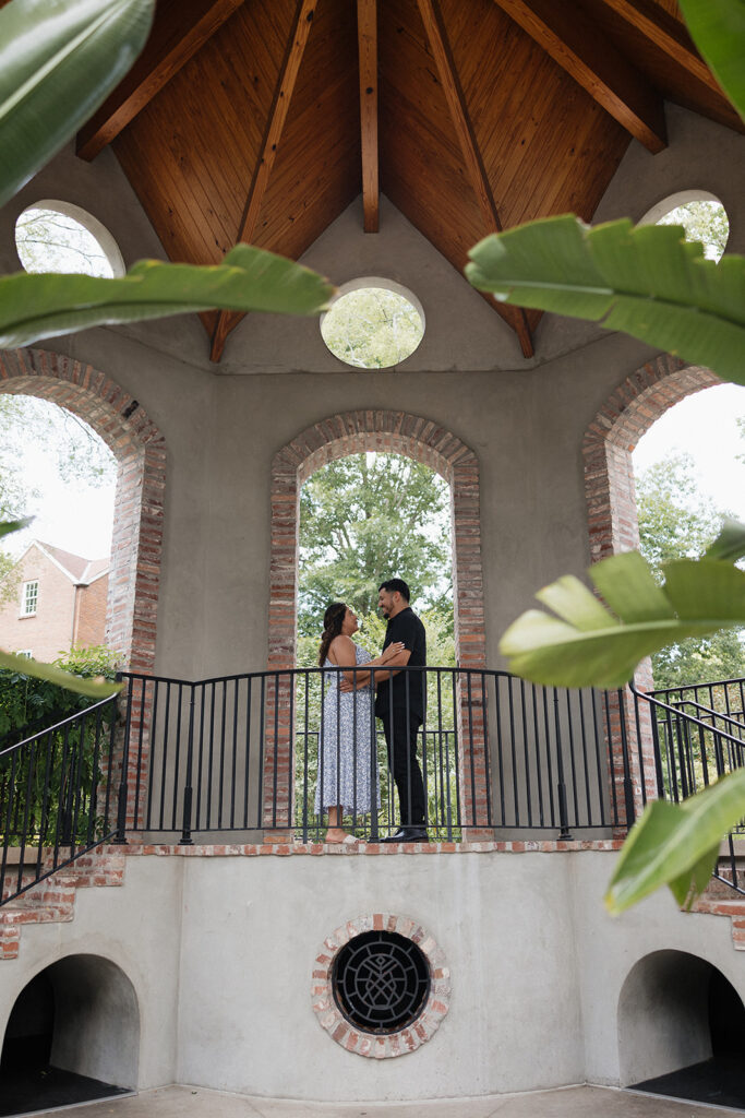 coupe kissing during their proposal photos