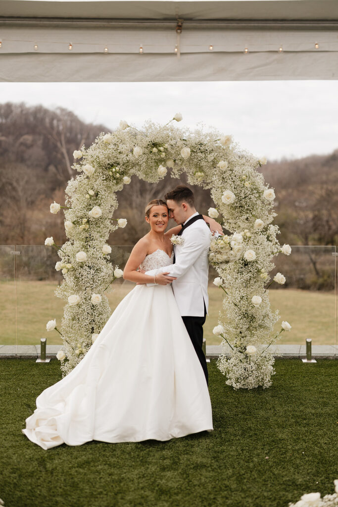 groom kissing the bride on the cheek