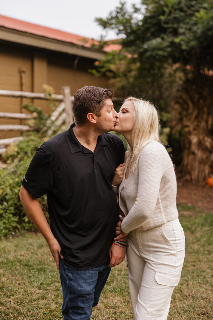 cute picture of the couple kissing during their photoshoot