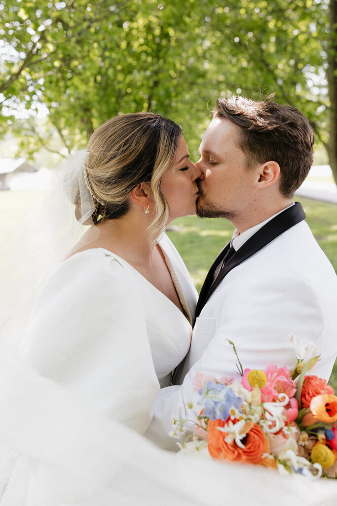 stunning portrait of the bride and groom kissing