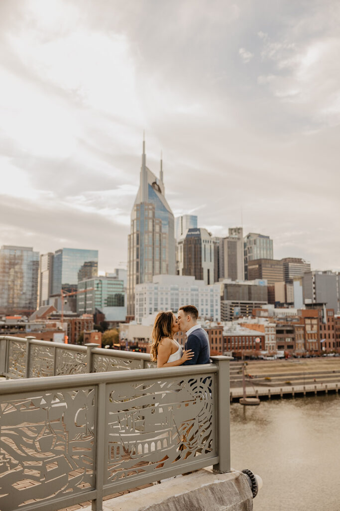 cute picture of the couple kissing during their photoshoot in nashville