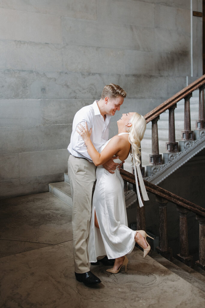 couple laughing with each other during their session