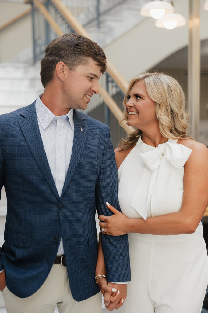 couple looking and smiling at each other during their session