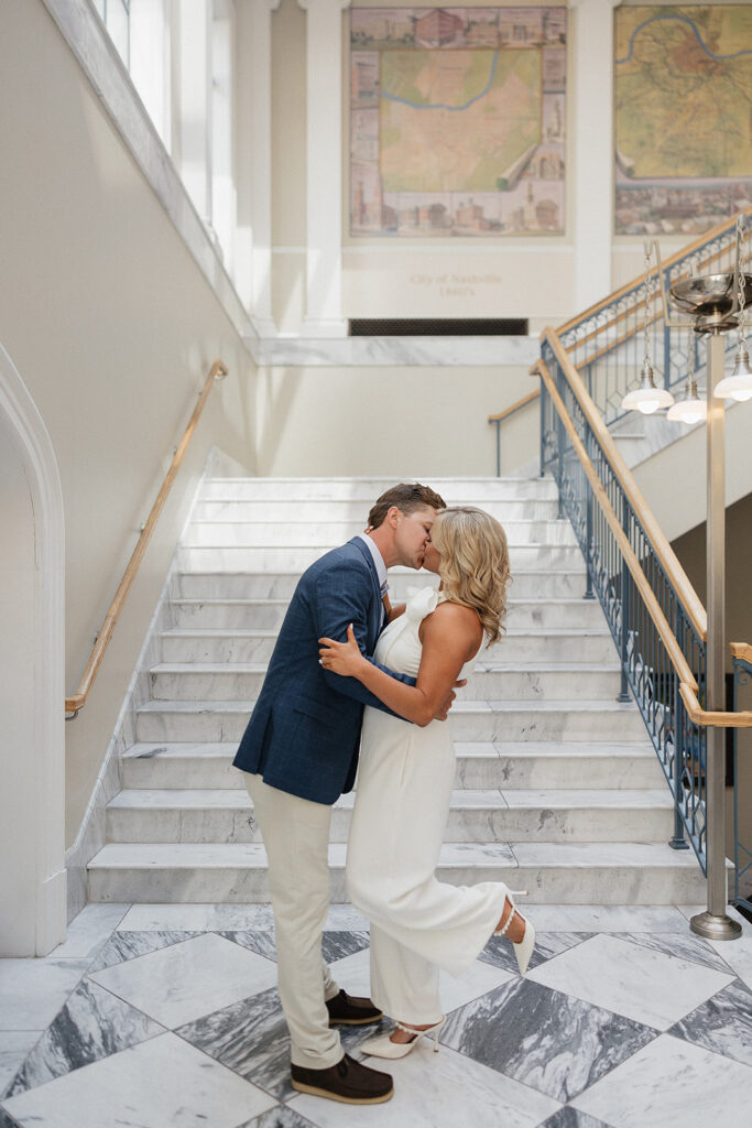 cute picture of the newly engaged couple kissing