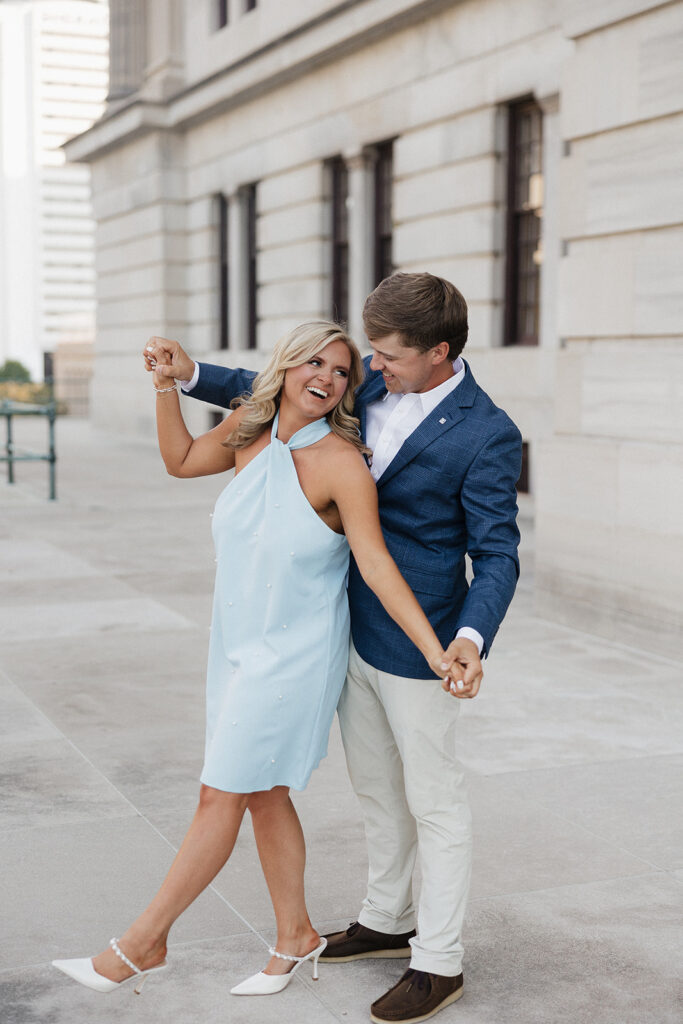 cute couple dancing during their photoshoot