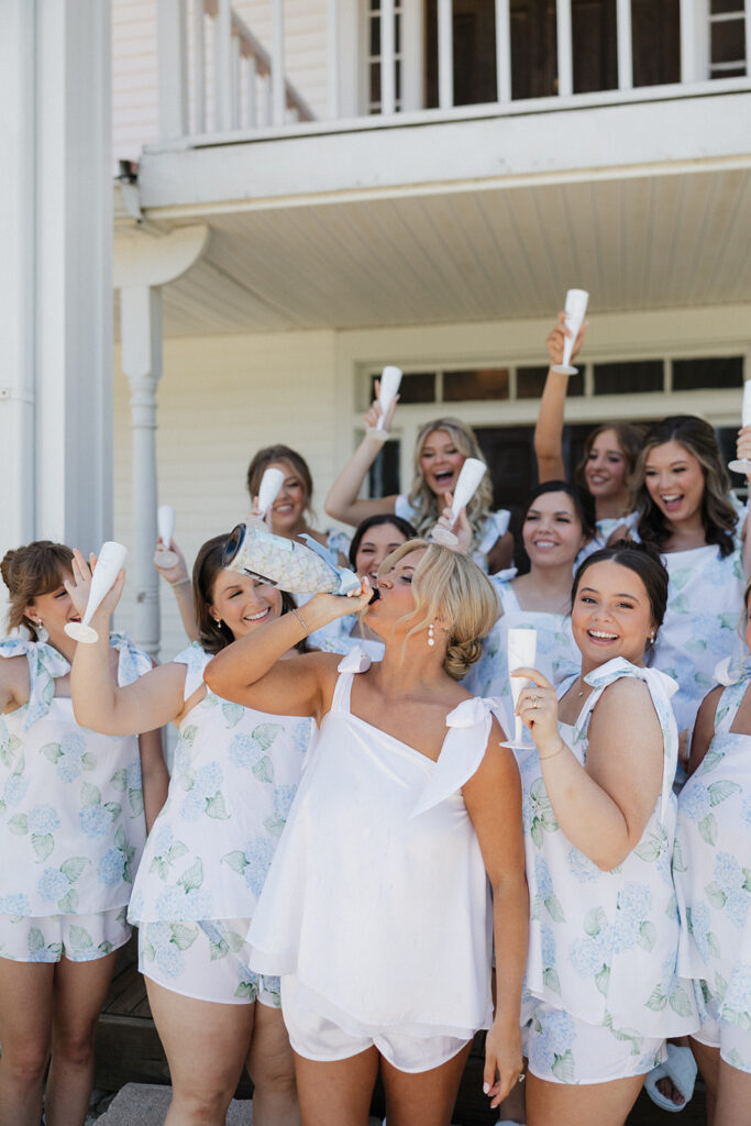 bride and her friends celebrating with champagne before the ceremony