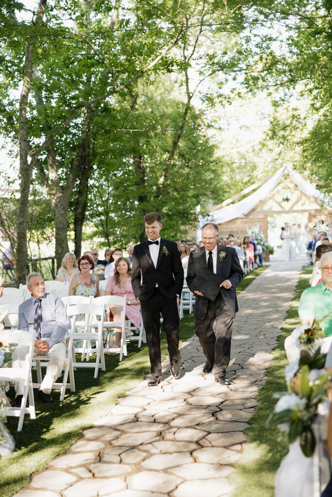 picture of the groom walking down the aisle 